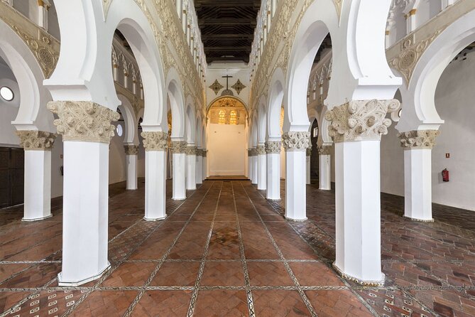 All-Inclusive Day Trip to Toledo with Priority Entry 7 Monuments - Santa María la Blanca and Santo Tomé: Where Faith Meets Art