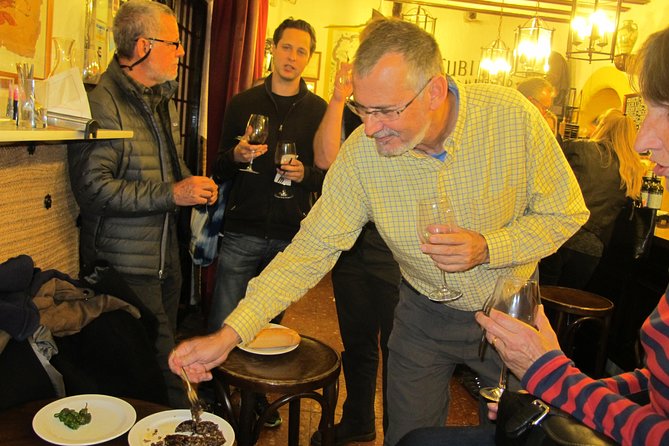 Madrid by Night Small Group Tour: Stories, Sights and Tapas Bites - First Bar Magic: Included Tastings and a Guided Ordering Lesson