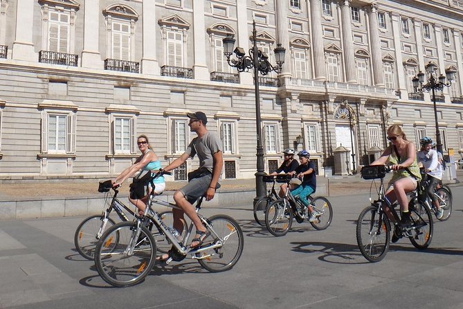 Madrid E-Bike Small Group Tour - Royal Palace area stop: history outside the grand door