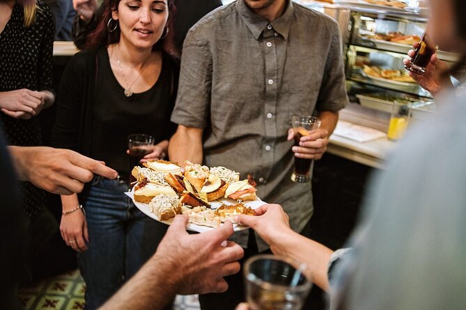 Madrid Evening Tapas and Wine Guided Tour - Stop 3, Muñiz: historic tavern tapas and the slow-cooked stew odds
