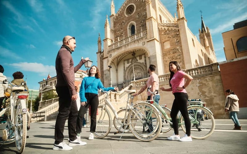 Madrid: Highlights Guided Vintage Bike Tour and Tapas Option - Las Letras Quarter to Puerta del Sol, where you feel the city pulse