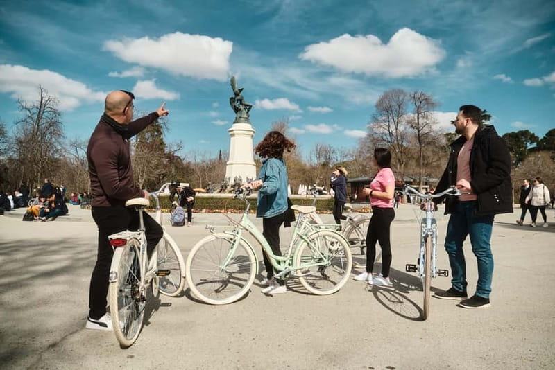 Madrid: Highlights Guided Vintage Bike Tour and Tapas Option - Royal Palace photo moments and the old-square rhythm of Madrid