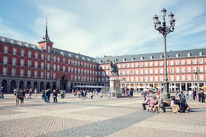 Madrid Historic Centre Food Tour with Authentic Tapas & Wines - Inside a deli over 180 years old: ham, manchego, olive oil