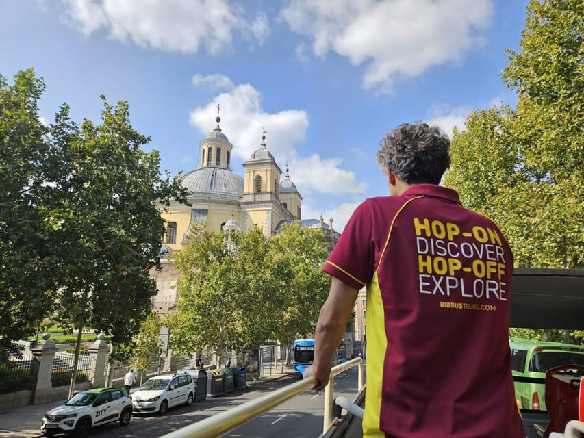 Madrid: Open-Top Big Bus Sightseeing Tour with Live Guide - Puerta de Alcalá and the Avenue That Pulls You Through the City