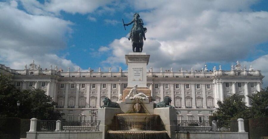 Madrid: Royal Palace and Almudena Cathedral Small-Group Tour - Crossing Plaza de la Armería into the Royal Palace