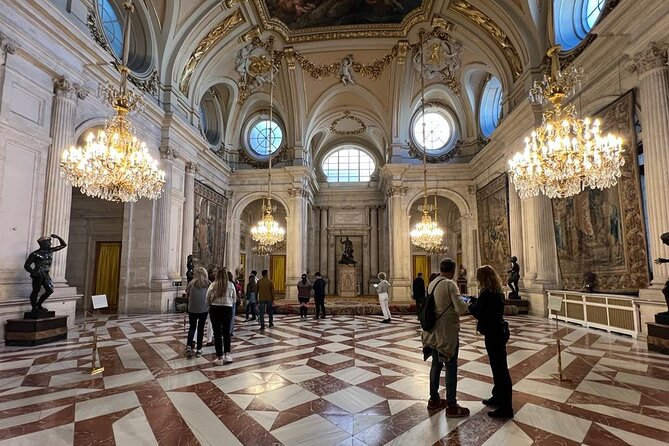 Madrid: Royal Palace Guided Tour with Skip the Line Ticket - Meeting at Madrid Souvenirs and Getting Through Faster