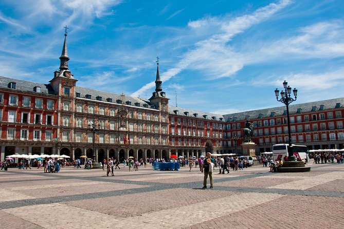 Madrid Sightseeing Tour with Royal Palace Skip the Line Ticket - The story thread: Moorish origins, Habsburg monuments, Charles III, then modern Madrid