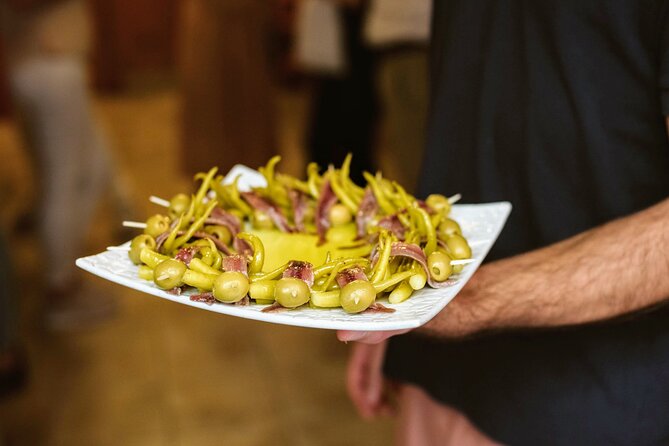 Madrid Tapas & Paella Cooking Experience with Local Market Visit - Lunch with beer or wine, plus fruit dessert