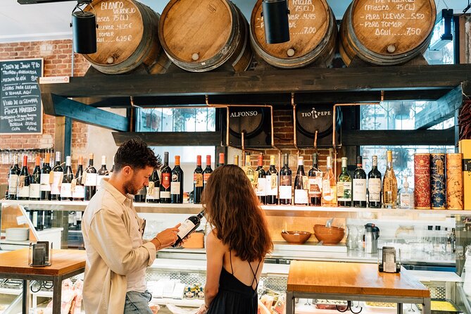 Madrid Tapas & Wine Tour with Rooftop Views and Local Guide - Stop 1: San Miguel Square Tapas, Padrón Peppers, and a Beer or Cider Pairing
