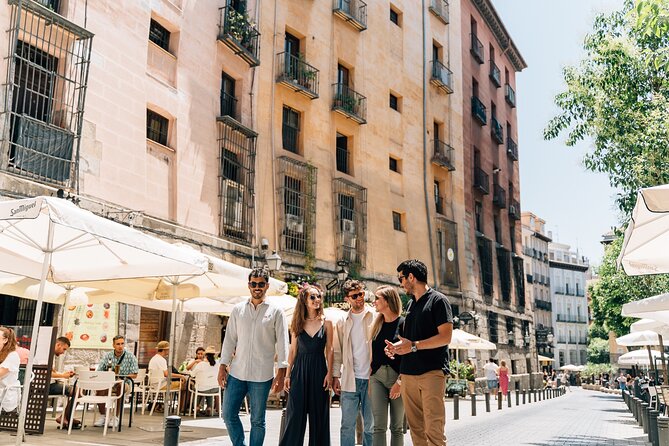 Madrid Tapas & Wine Tour with Rooftop Views and Local Guide - Stop 2: Plaza Mayor Ham and Iberian Sausage With Wine Pairings