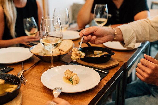 Madrid Tapas & Wine Tour with Rooftop Views and Local Guide - The Rooftop Finale at Gran Via: Cava Glass and Madrid Views