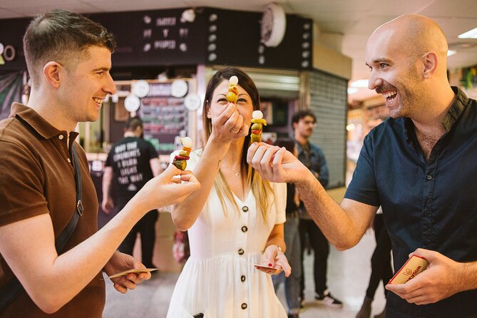Madrid Ultimate Spanish Cuisine Food Tour - Antón Martín Market, Where Olives, Meats, and Olive Oil Get Explained