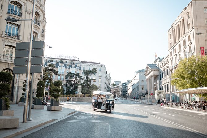 Madrid Welcome Tour with Local Guide in Eco Tuk Tuk Private - Private 100 percent electric tuk tuk, minus the hassle