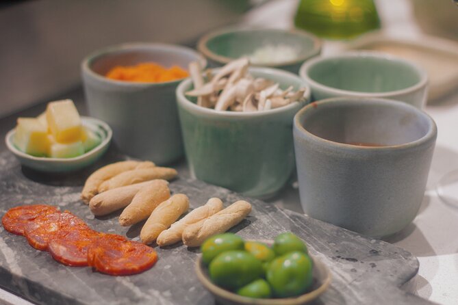 Paella Cooking Class in Madrid with Bottomless Wine Pairing - Your 5-Course Meal at the Communal Table
