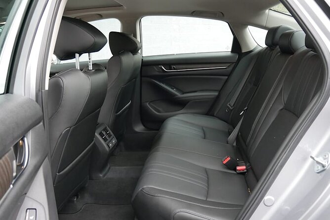 Round Trip Transfer from Madrid Airport MAD to Madrid by Sedan - Meet and greet in arrivals: the sign, the lounge, and your fallback plan
