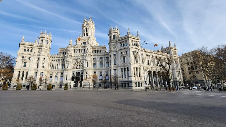 Tour Madrid: Secrets in a Electric Tuk Tuk - Puerta del Sol symbols: clocks, street-level icons, and quick orientation